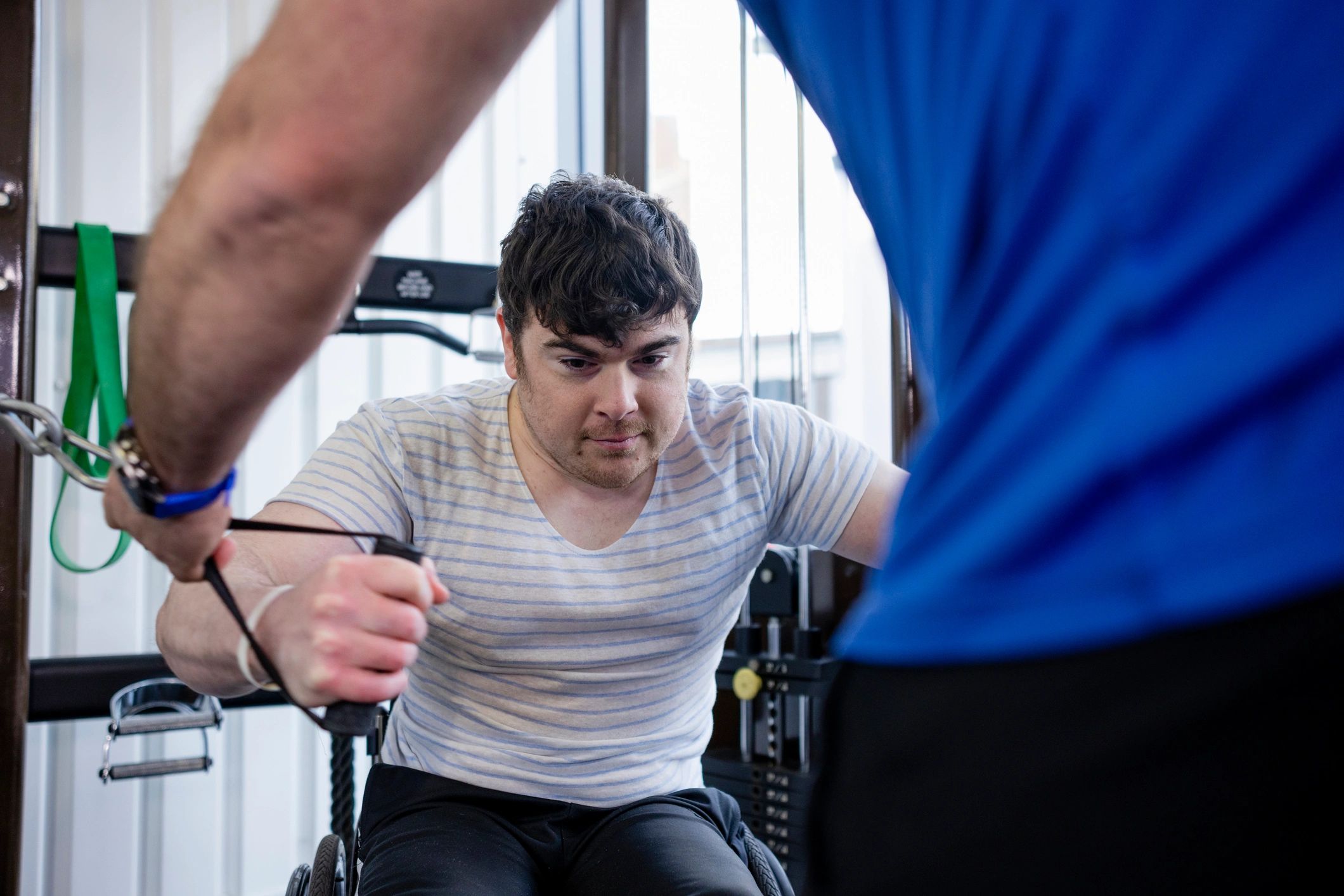 Therapist guiding a rehabilitation exercise session